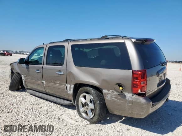 2014 Chevrolet Suburban LT with VIN 1GNSCJE05ER175420, listed as a Copart auction lot 91117505 with 165,340 mi miles and Salvage title. Bid and sale history available at DreamBid. Image 2.