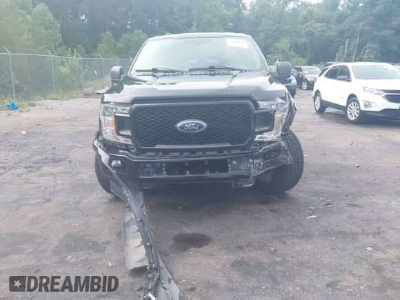 2019 Ford F-150 XL with VIN 1FTEW1E54KFB76726, listed as a IAAI auction lot 42970886 with 128,574 mi miles and . Bid and sale history available at DreamBid. Image 12.