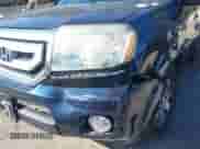 2009 Honda Pilot Touring with VIN 5FNYF489X9B007452, listed as a IAAI auction lot 43262557 with 206,355 mi miles and . Bid and sale history available at DreamBid. Image 6.