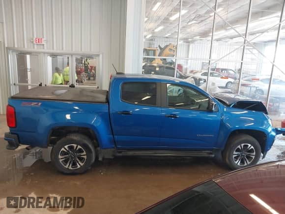 2021 Chevrolet Colorado 4WD Z71 z VIN 1GCGTDEN7M1141049, wystawiony jako IAAI lot #41223962 z przebiegiem 62 114 mil mil oraz . Historia ofert i sprzedaży dostępna na DreamBid. Obrazek 13.