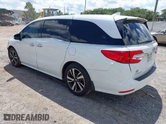 2020 Honda Odyssey Elite with VIN 5FNRL6H97LB058312, listed as a IAAI auction lot 42954678 with 92,976 mi miles and . Bid and sale history available at DreamBid. Image 3.