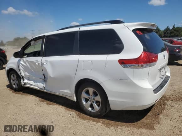 2014 Toyota Sienna LE with VIN 5TDKK3DC4ES411981, listed as a Copart auction lot 63111835 with 149,248 mi miles and Salvage title. Bid and sale history available at DreamBid. Image 2.