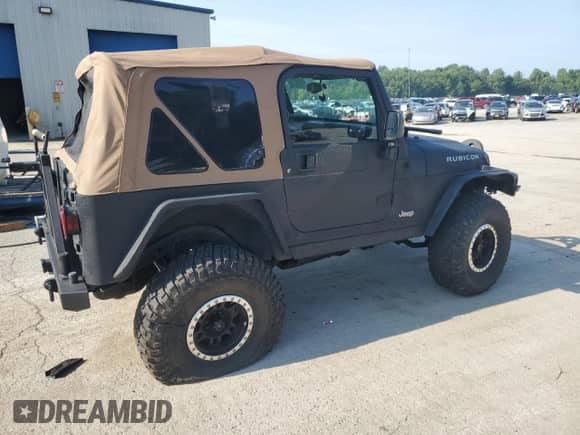 2003 Jeep Wrangler Rubicon с VIN 1J4FA69S23P310588, выставлен на аукционе Copart как лот 66919775 с пробегом 106 685 миль миль и Списание • Salvage title. История ставок и продаж доступна на DreamBid. Изображение 3.