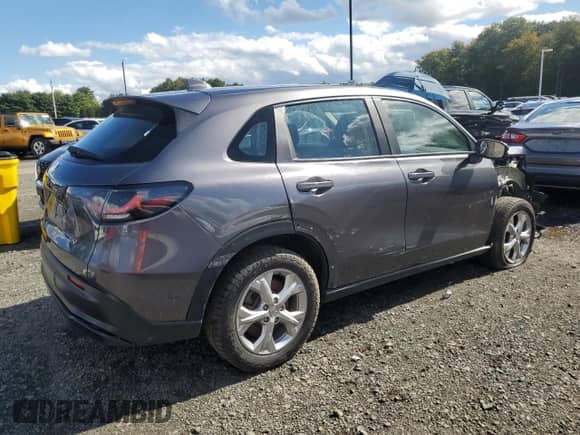 2023 Honda HR-V LX with VIN 3CZRZ2H32PM721882, listed as a Copart auction lot 82169025 with 77,864 mi miles and Clean title. Bid and sale history available at DreamBid. Image 3.