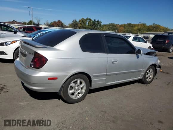2005 Hyundai Accent GLS с VIN KMHCG35C05U331928, выставлен на аукционе Copart как лот 74672614 с пробегом 41 542 миль миль и Списание • Salvage title. История ставок и продаж доступна на DreamBid. Изображение 3.