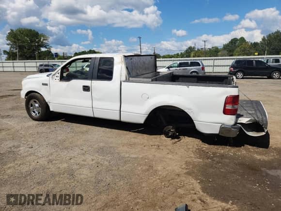2007 Ford F-150 STX with VIN 1FTRX12W57FA37403, listed as a Copart auction lot 84213265 with 2,342,455 mi miles and Salvage title. Bid and sale history available at DreamBid. Image 2.