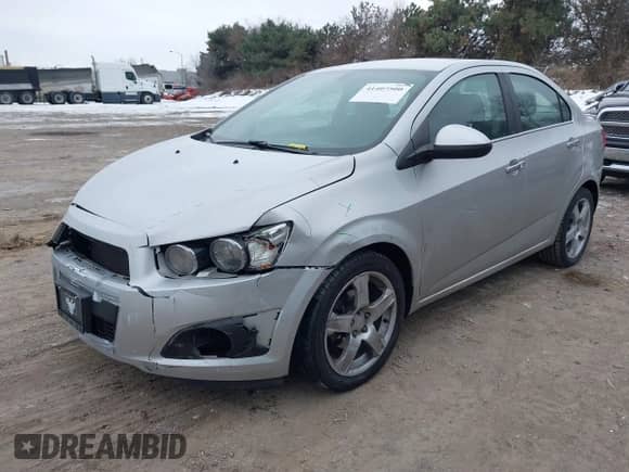 2014 Chevrolet Sonic LTZ z VIN 1G1JE5SB6E4218485, wystawiony jako IAAI lot #41407500 z przebiegiem 93 588 mil mil oraz . Historia ofert i sprzedaży dostępna na DreamBid. Obrazek 2.