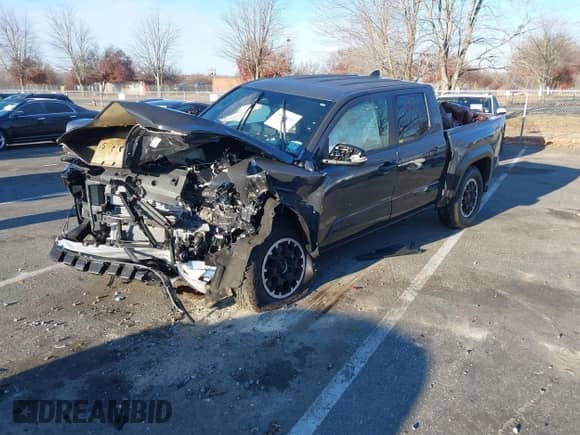 2024 Toyota Tacoma SR5 with VIN 3TMLB5JN3RM028853, listed as a IAAI auction lot 40990601 with 10,095 mi miles and . Bid and sale history available at DreamBid. Image 2.