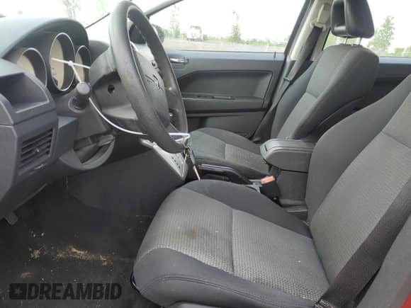 2009 Dodge Caliber SXT with VIN 1B3HB48A79D229770, listed as a Copart auction lot 58482155 with Not provided miles and Salvage title. Bid and sale history available at DreamBid. Image 7.