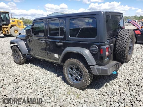 2023 Jeep Wrangler with VIN 1C4JJXN67PW703819, listed as a Copart auction lot 69967635 with 73,238 mi miles and Salvage title. Bid and sale history available at DreamBid. Image 2.