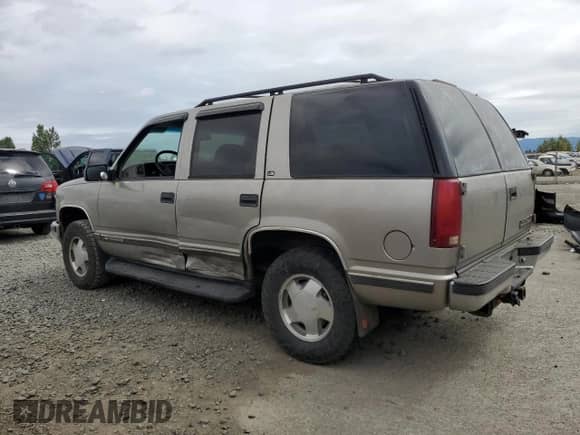 1999 Chevrolet Tahoe Z71 with VIN 1GNEK13R9XJ504722, listed as a Copart auction lot 61067465 with 215,951 mi miles and Salvage title. Bid and sale history available at DreamBid. Image 2.