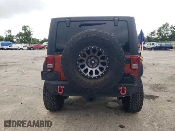 2014 Jeep Wrangler Rubicon with VIN 1C4BJWCG2EL303420, listed as a Copart auction lot 63550985 with 87,175 mi miles and Salvage title. Bid and sale history available at DreamBid. Image 6.
