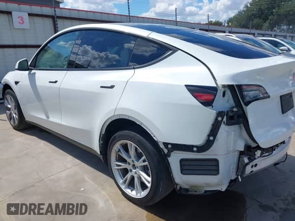 2023 Tesla Model Y Long Range with VIN 7SAYGDEE6PA078790, listed as a IAAI auction lot 43261075 with 20,370 mi miles and . Bid and sale history available at DreamBid. Image 3.
