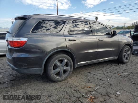 2013 Dodge Durango SXT with VIN 1C4RDHAG0DC694375, listed as a Copart auction lot 82360515 with 219,201 mi miles and Salvage title. Bid and sale history available at DreamBid. Image 3.