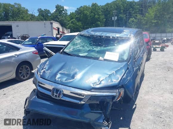 2020 Honda Pilot EX-L with VIN 5FNYF5H57LB026759, listed as a IAAI auction lot 42649916 with Not provided miles and . Bid and sale history available at DreamBid. Image 6.