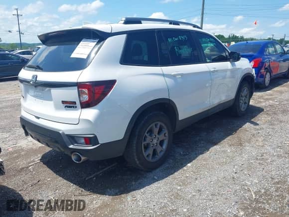 2024 Honda Passport TrailSport with VIN 5FNYF8H63RB009699, listed as a IAAI auction lot 42299966 with 12,393 mi miles and . Bid and sale history available at DreamBid. Image 4.