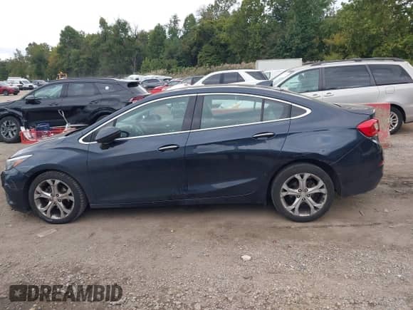 2016 Chevrolet Cruze Premier z VIN 1G1BG5SM3G7310042, wystawiony jako IAAI lot #43433758 z przebiegiem 219 405 mil mil oraz . Historia ofert i sprzedaży dostępna na DreamBid. Obrazek 14.