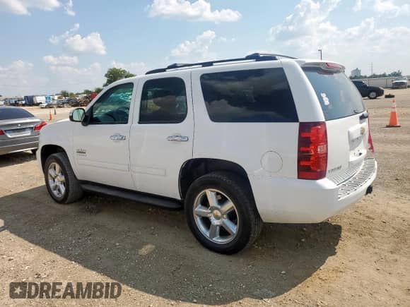 2013 Chevrolet Tahoe LS z VIN 1GNSCAE02DR289275, wystawiony jako Copart lot #80833405 z przebiegiem 185 118 mil mil oraz Szkoda całkowita • Salvage title. Historia ofert i sprzedaży dostępna na DreamBid. Obrazek 2.