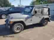 2000 Jeep Wrangler SE with VIN 1J4FA29P4YP775935, listed as a Copart auction lot 80458955 with 100,211 mi miles and Salvage title. Bid and sale history available at DreamBid. Image 1.