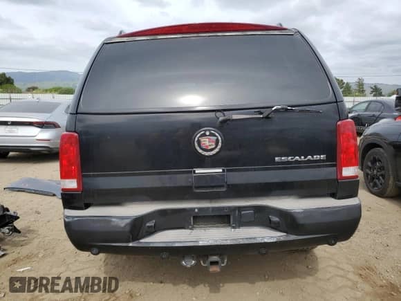 2004 Cadillac Escalade with VIN 1GYEC63T64R260162, listed as a Copart auction lot 54725685 with 223,615 mi miles and Salvage title. Bid and sale history available at DreamBid. Image 6.