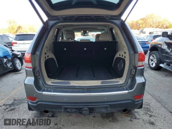 2012 Jeep Grand Cherokee Limited z VIN 1C4RJFBT3CC246526, wystawiony jako Copart lot #74776133 z przebiegiem 162 805 mil mil oraz Szkoda całkowita • Salvage title. Historia ofert i sprzedaży dostępna na DreamBid. Obrazek 6.