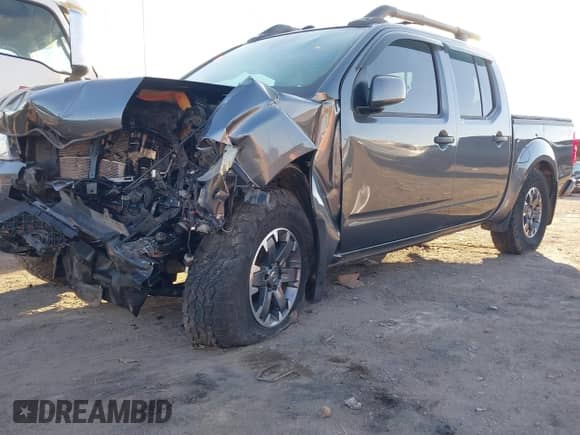 2020 Nissan Frontier Pro-4X with VIN 1N6ED0EB1LN708265, listed as a IAAI auction lot 41398914 with 98,665 mi miles and . Bid and sale history available at DreamBid. Image 2.