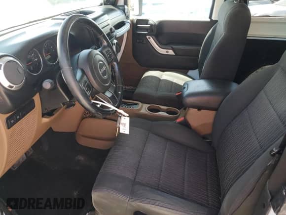 2011 Jeep Wrangler Rubicon with VIN 1J4BA6D12BL535953, listed as a Copart auction lot 59401595 with 77,451 mi miles and Salvage title. Bid and sale history available at DreamBid. Image 7.