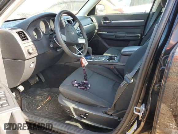 2009 Dodge Charger SXT z VIN 2B3KA33V49H573525, wystawiony jako Copart lot #76044134 z przebiegiem 98 420 mil mil oraz Czysty tytuł • Clean title. Historia ofert i sprzedaży dostępna na DreamBid. Obrazek 7.