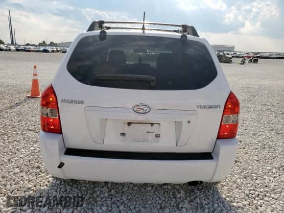 2006 Hyundai Tucson GL z VIN KM8JM12B26U413760, wystawiony jako Copart lot #81619485 z przebiegiem 93 173 mil mil oraz Szkoda całkowita • Salvage title. Historia ofert i sprzedaży dostępna na DreamBid. Obrazek 6.