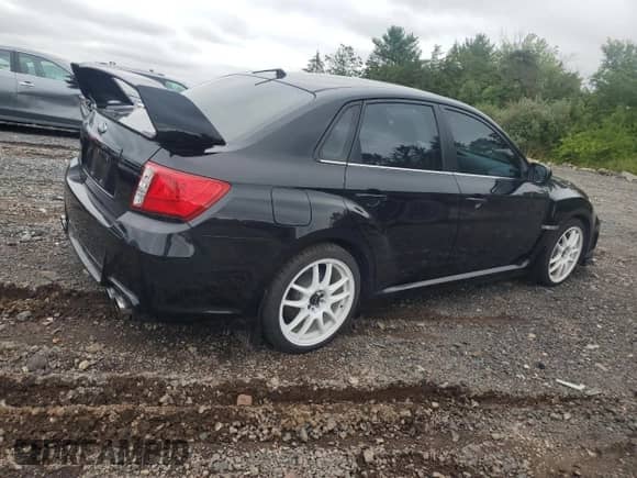 2013 Subaru WRX WRX with VIN JF1GV7F6XDG013619, listed as a Copart auction lot 68992015 with 141,795 mi miles and Salvage title. Bid and sale history available at DreamBid. Image 3.