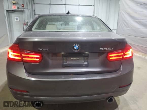 2015 BMW 3 Series 335i xDrive with VIN WBA3B9G57FNR99402, listed as a Copart auction lot 70015545 with 127,455 mi miles and Salvage title. Bid and sale history available at DreamBid. Image 6.