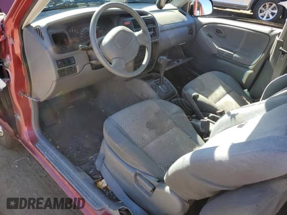 1999 Chevrolet Tracker z VIN 2CNBJ13C2X6911316, wystawiony jako Copart lot #74851094 z przebiegiem Nie podano mil oraz Szkoda całkowita • Salvage title. Historia ofert i sprzedaży dostępna na DreamBid. Obrazek 8.