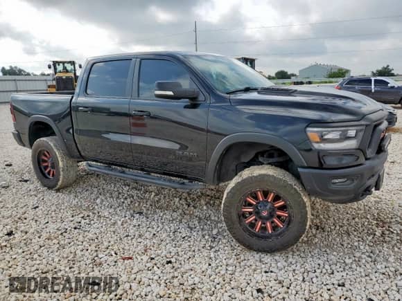 2020 Ram 1500 Rebel z VIN 1C6SRFLT6LN127034, wystawiony jako Copart lot #64791005 z przebiegiem 86 689 mil mil oraz Szkoda całkowita • Salvage title. Historia ofert i sprzedaży dostępna na DreamBid. Obrazek 4.