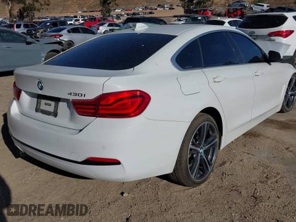 2019 BMW 4 Series 430i with VIN WBA4J1C5XKBM18159, listed as a IAAI auction lot 41267934 with 79,346 mi miles and . Bid and sale history available at DreamBid. Image 4.