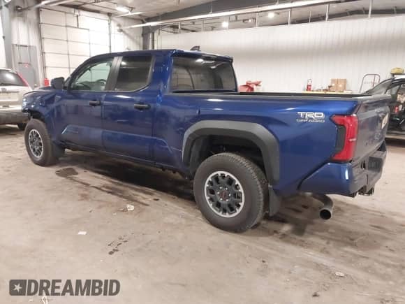2024 Toyota Tacoma SR5 with VIN 3TMLB5JN3RM054207, listed as a IAAI auction lot 41171946 with 3,808 mi miles and . Bid and sale history available at DreamBid. Image 3.