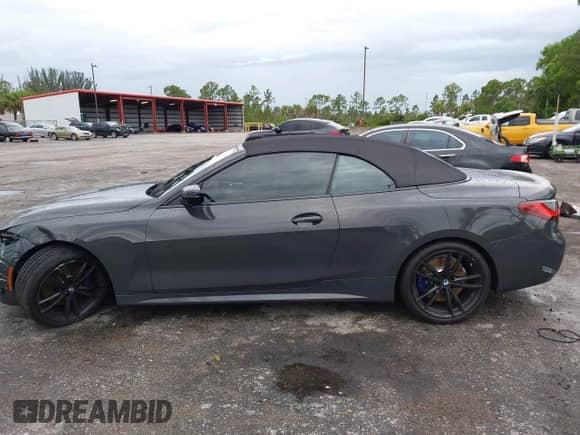 2023 BMW 4 Series 430i with VIN WBA23AT03PCL21070, listed as a IAAI auction lot 42730718 with 19,859 mi miles and . Bid and sale history available at DreamBid. Image 14.