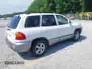 2003 Hyundai Santa Fe GLS z VIN KM8SC73D13U507909, wystawiony jako IAAI lot #42507556 z przebiegiem 216 986 mil mil oraz . Historia ofert i sprzedaży dostępna na DreamBid. Obrazek 4.