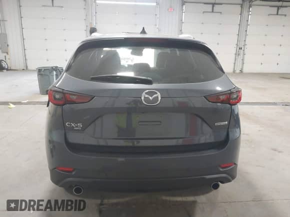 2023 Mazda CX-5 S Carbon Edition z VIN JM3KFBCM8P0261086, wystawiony jako IAAI lot #42215690 z przebiegiem 23 730 mil mil oraz . Historia ofert i sprzedaży dostępna na DreamBid. Obrazek 16.