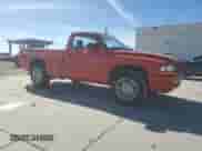 2000 Dodge Dakota Sport with VIN 1B7GL26N4YS797289, listed as a Copart auction lot 90517435 with 161,517 mi miles and Salvage title. Bid and sale history available at DreamBid. Image 4.