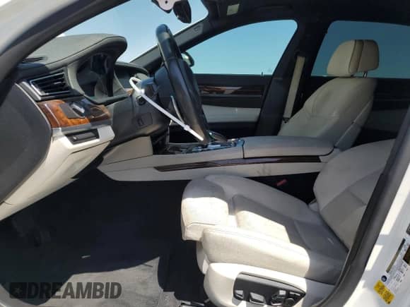 2014 BMW 7 Series 740Li с VIN WBAYE4C56ED138402, выставлен на аукционе Copart как лот 59127205 с пробегом 103 829 миль миль и Списание • Salvage title. История ставок и продаж доступна на DreamBid. Изображение 7.