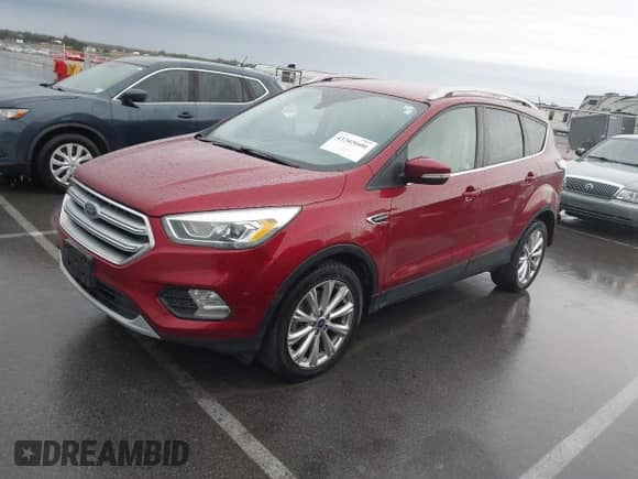 2017 Ford Escape Titanium z VIN 1FMCU9J97HUA95899, wystawiony jako IAAI lot #43365600 z przebiegiem 95 376 mil mil oraz . Historia ofert i sprzedaży dostępna na DreamBid. Obrazek 2.