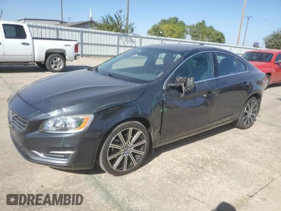 2015 Volvo S60 with VIN YV126MFD0F1309666, listed as a Copart auction lot 77844894 with 130,570 mi miles and Salvage title. Bid and sale history available at DreamBid. Image 1.