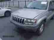 2003 Jeep Grand Cherokee Laredo z VIN 1J4GX48S63C506971, wystawiony jako IAAI lot #43217099 z przebiegiem 163 485 mil mil oraz . Historia ofert i sprzedaży dostępna na DreamBid. Obrazek 6.