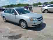 2005 Chevrolet Malibu z VIN 1G1ZS52F65F294095, wystawiony jako IAAI lot #42645603 z przebiegiem 146 284 mil mil oraz . Historia ofert i sprzedaży dostępna na DreamBid. Obrazek 1.