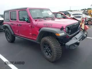 2024 Jeep Wrangler Sport S with VIN 1C4PJXDG2RW323150, listed as a IAAI auction lot 42915821 with 11,368 mi miles and . Bid and sale history available at DreamBid. Image 1.