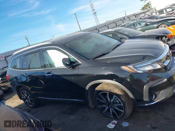 2022 Honda Pilot Elite with VIN 5FNYF6H03NB085997, listed as a IAAI auction lot 41823176 with 21,646 mi miles and . Bid and sale history available at DreamBid. Image 13.