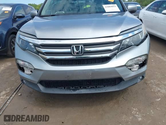 2018 Honda Pilot EX-L with VIN 5FNYF6H76JB035649, listed as a IAAI auction lot 43004811 with 84,008 mi miles and . Bid and sale history available at DreamBid. Image 6.