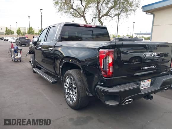2024 GMC Sierra 1500 Denali Ultimate with VIN 1GTUUHEL6RZ384138, listed as a IAAI auction lot 43111543 with 27,138 mi miles and . Bid and sale history available at DreamBid. Image 3.