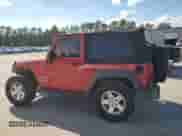 2010 Jeep Wrangler Sport with VIN 1J4AA2D13AL230819, listed as a Copart auction lot 81859015 with 104,290 mi miles and Salvage title. Bid and sale history available at DreamBid. Image 2.