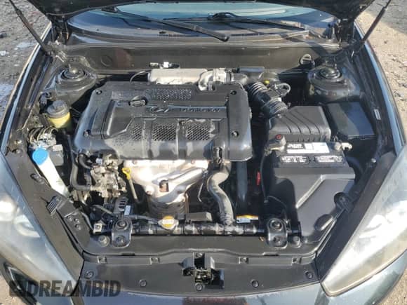 2008 Hyundai Tiburon GS z VIN KMHHM66D28U287992, wystawiony jako Copart lot #55080195 z przebiegiem 125 922 mil mil oraz Nie do naprawy • Non repairable. Historia ofert i sprzedaży dostępna na DreamBid. Obrazek 11.